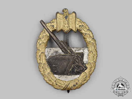 germany,_kriegsmarine._a_coastal_artillery_war_badge,_by_schwerin&_sohn_m21_mnc5502