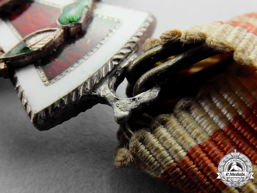 austria._an_austrian_honour_decoration_of_the_red_cross,2_nd_class_cross_with_war_decoration_m_638_1_1