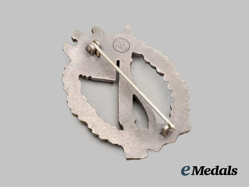 germany,_wehrmacht._a_mint_infantry_assault_badge,_silver_grade,_by_gebrüder_wegerhoff__mnc6557b