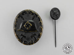 A Black Wound Badge With Miniature