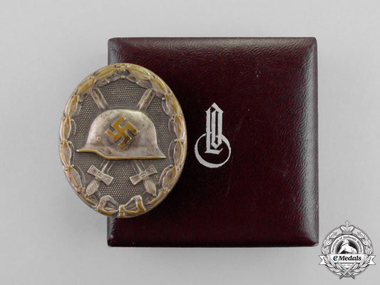 a1940_model_ldo_cased_silver_grade_wound_badge_by_c.f._zimmermann_o_328_1