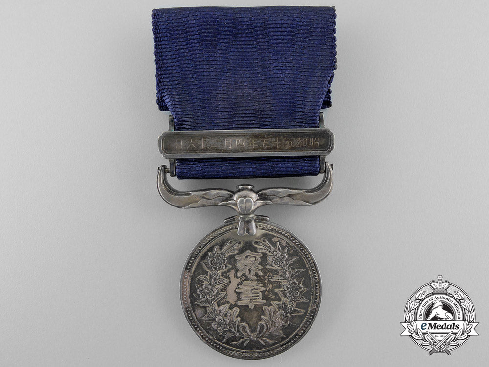 a_japanese_merit_medal_with_case;_named_to_recipient_o_765