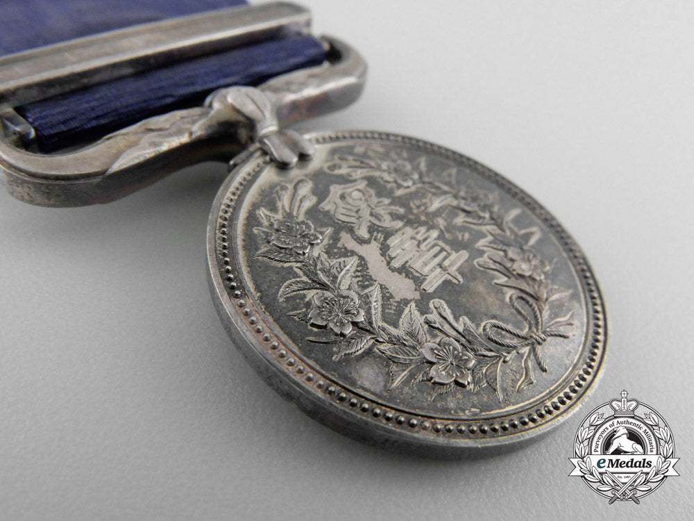 a_japanese_merit_medal_with_case;_named_to_recipient_o_767