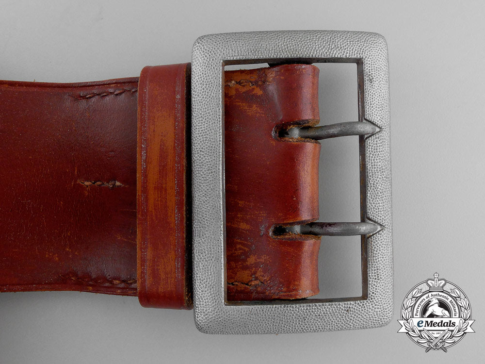 a_brown_leather_belt_with_double_open_claw_buckle;_heer_stamped_q_358