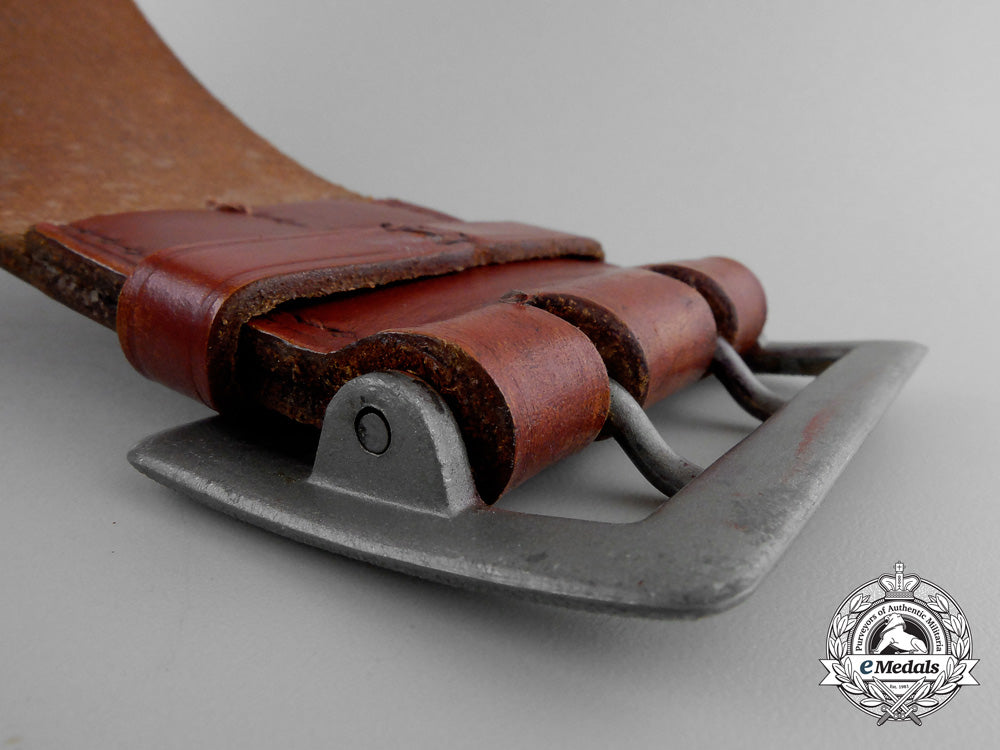 a_brown_leather_belt_with_double_open_claw_buckle;_heer_stamped_q_360