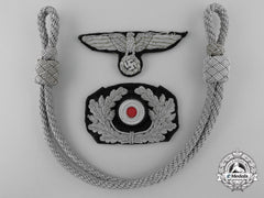 A Set Of German Army (Heer) Visor Insignia With Chin Strap