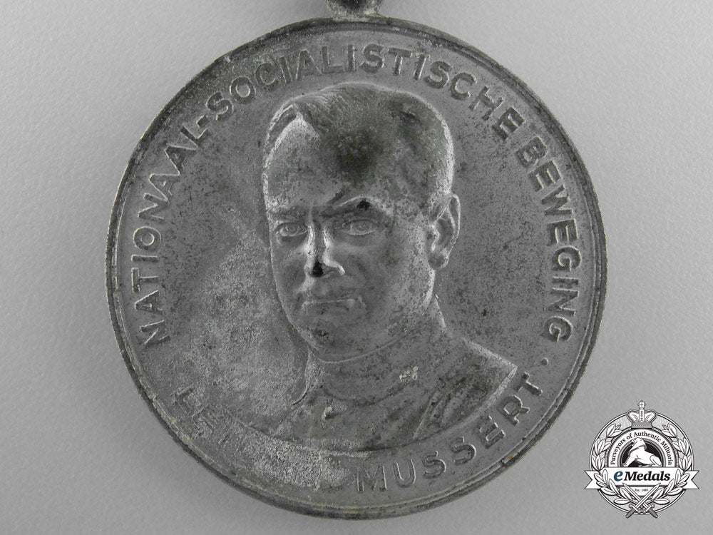 netherlands._a_scarce1941_nsb_kerstmarch_medal_u_524_2_1_1