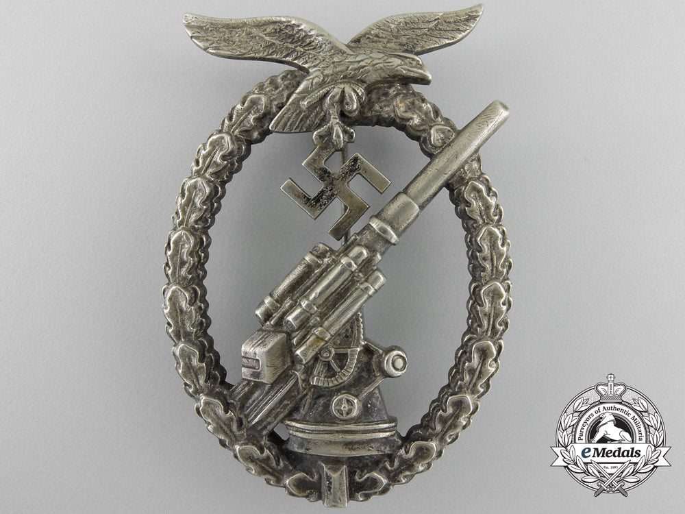 an_early_luftwaffe_flak_badge_in_tombac_with_ball_hinge_w_597