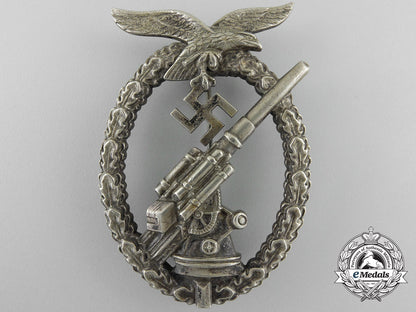an_early_luftwaffe_flak_badge_in_tombac_with_ball_hinge_w_597