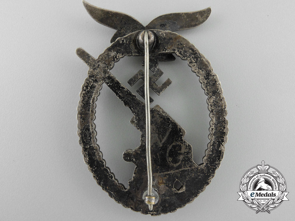 an_early_luftwaffe_flak_badge_in_tombac_with_ball_hinge_w_599