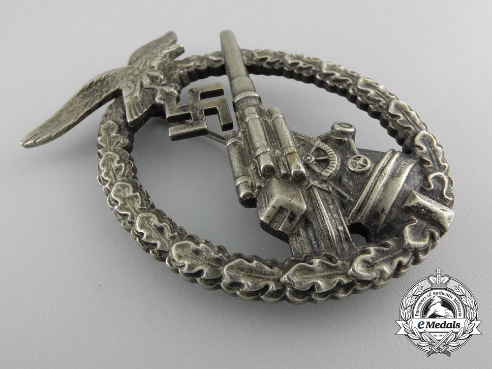 an_early_luftwaffe_flak_badge_in_tombac_with_ball_hinge_w_600